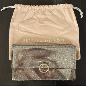 Rebecca Minkoff gold textured envelop clutch with gold metal loop closure.